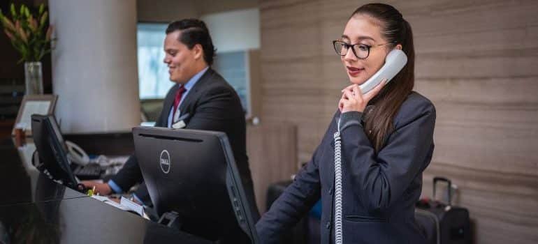 People working at the hotel reception