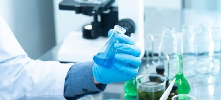A scientist doing an experiment in a lab