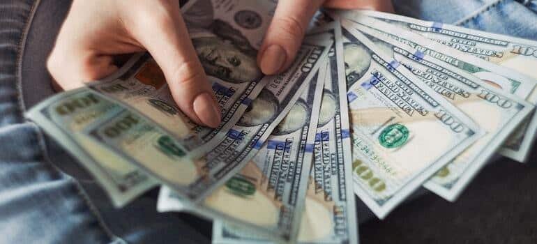 Dollar bills in a person's hand
