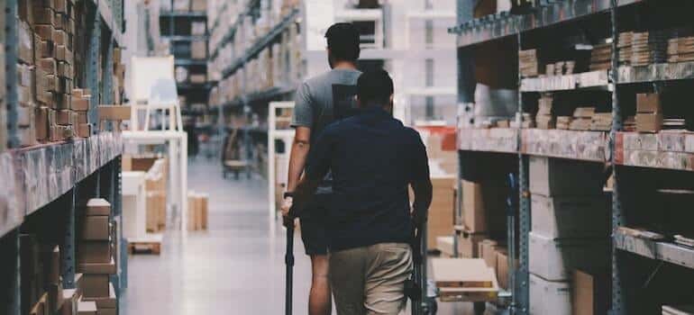 People putting items inside a warehouse