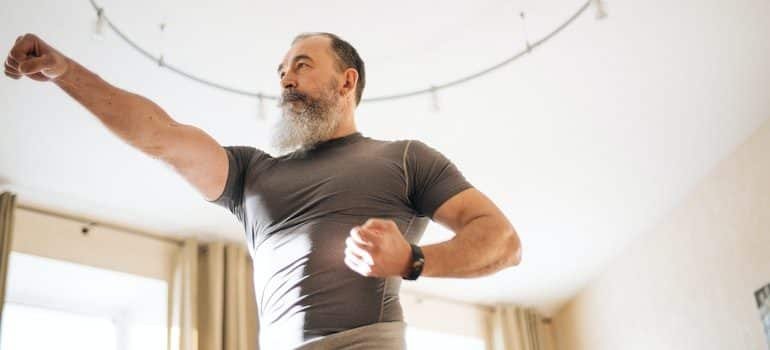 An elderly man working out