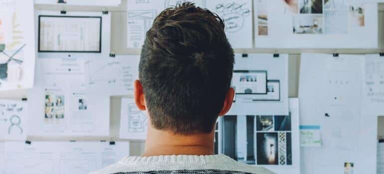 A person in front of a board